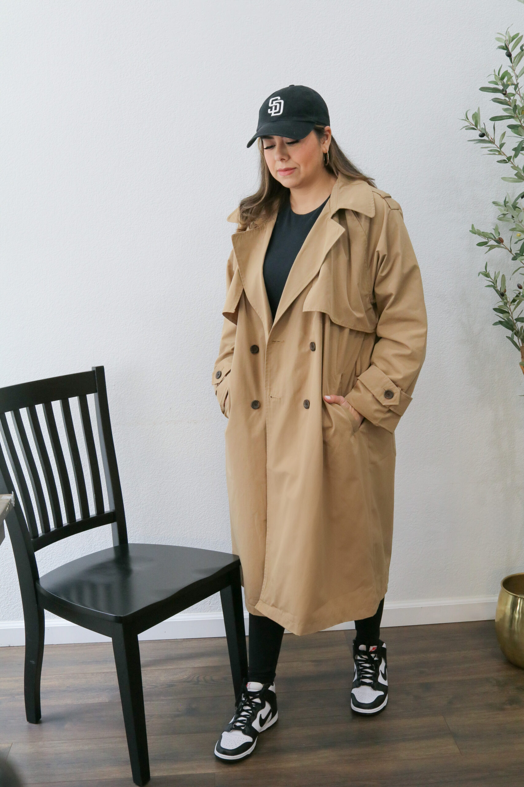 sporty trench coat outfit, how to style a long camel trench coat with sneakers, sporty vibe outfit