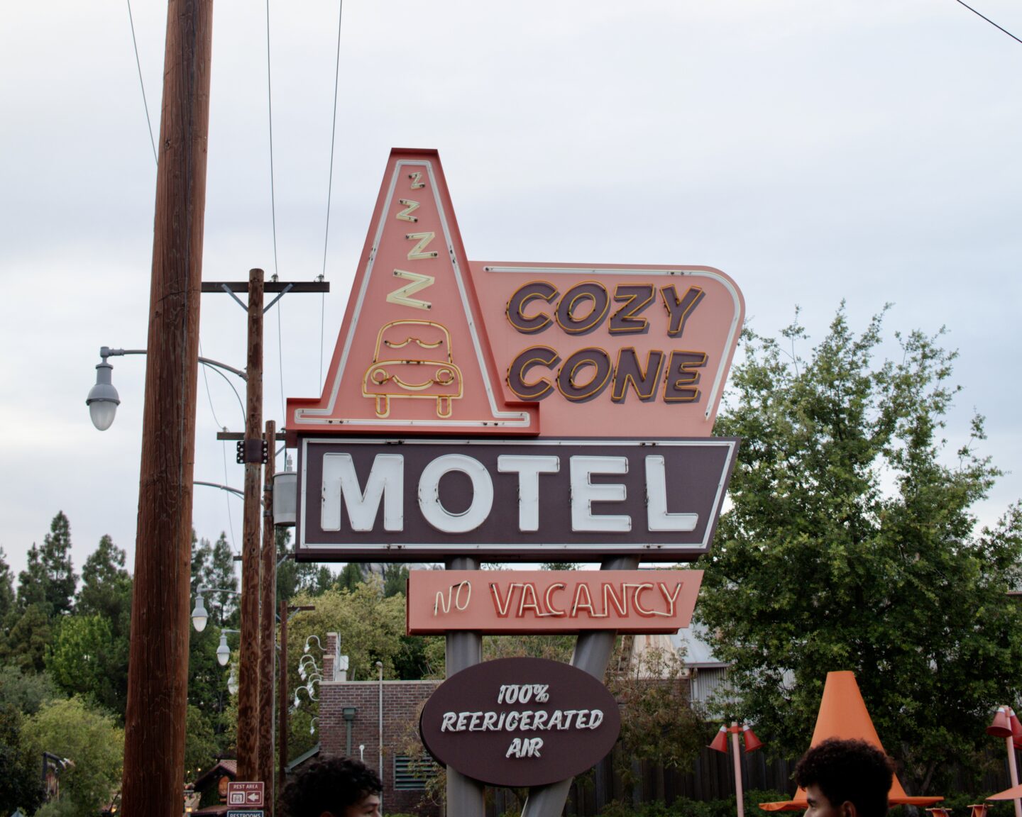 cozy cone motel cars land sign